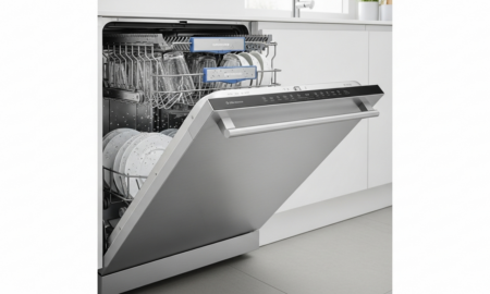 Open dishwasher with wet dishes illustrating a dishwasher not drying dishes problem