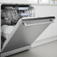 Open dishwasher with wet dishes illustrating a dishwasher not drying dishes problem