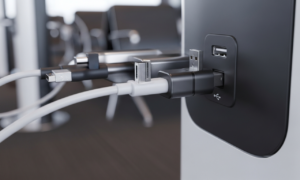 A USB data blocker plugged into a public charging station to prevent juice jacking