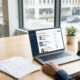 Hiring manager using AI resume screening tools on a laptop dashboard to rank job candidates