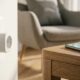 A smart plug plugged into a wall outlet, illustrating how to choose a smart plug for a home automation setup