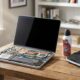 Laptop cooling fan and heatsink exposed during a laptop overheating fixes cleaning session