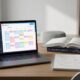 Student using AI study planners on a laptop and phone to organize an exam schedule