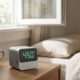 One of the best portable CO2 monitors displaying ppm readings on a nightstand